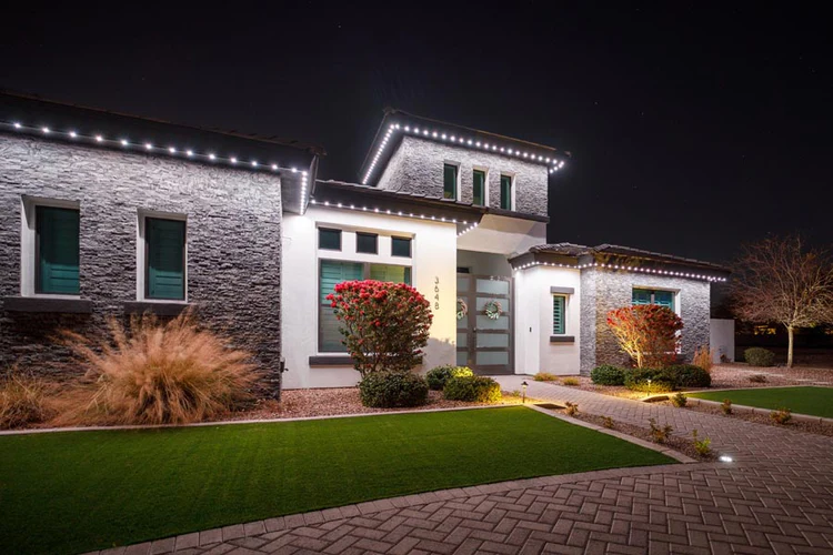 Evening patio and pool lit for entertaining